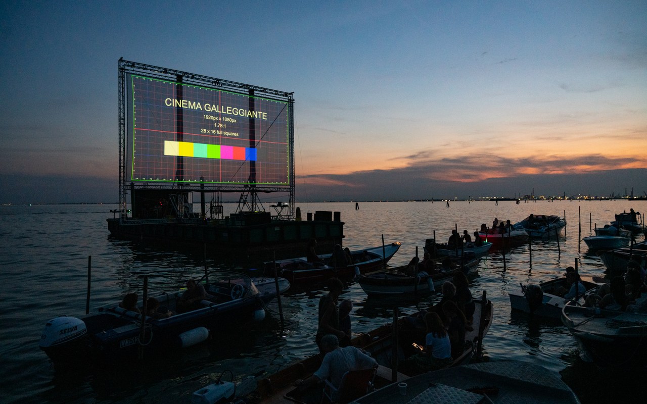 Floating Cinema at sunset in the Venice lagoon